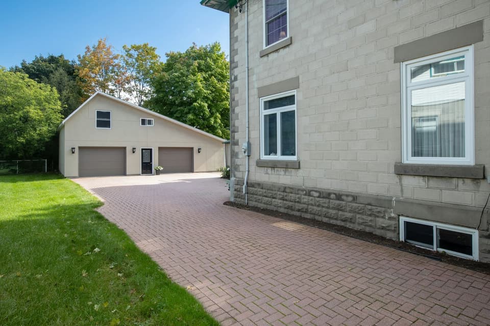 A herringbone brick paver driveway in good condition