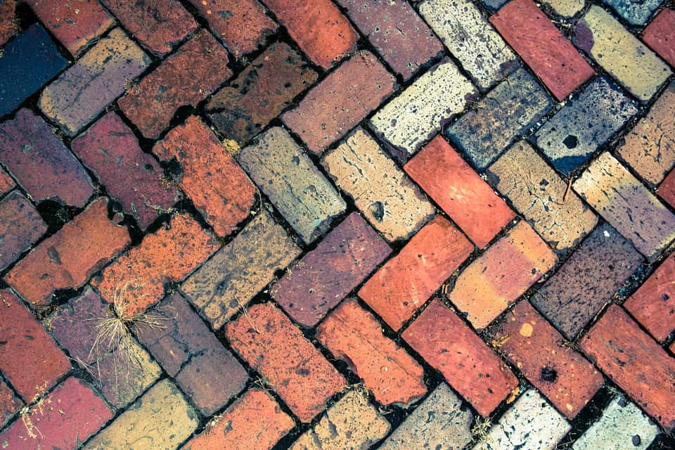 Paver bricks sitting unevenly across a surface
